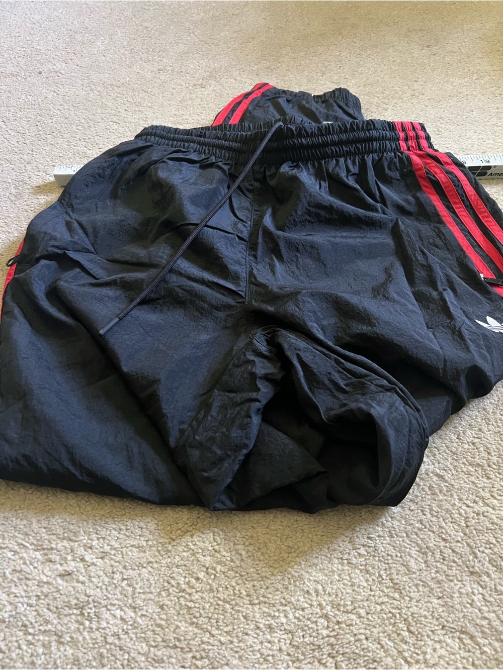 Men’s Adidas  Black Wind Joggers with Red Side Stripes, in great shape